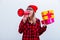 Girl with gift boxes and megaphone on white background