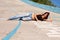 girl, the girl lying on a concrete slab