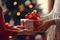 The girl gives a gift on the background of a Christmas tree