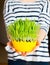 Girl giving green oat sprouts for easter