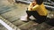 Girl with Glasses Yellow Sweater Sitting on the Stairs Concept