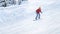 Girl goes on a snowboard at the ski slopes