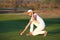 Girl golf player on field