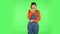 Girl got a cold, sore throat and head, cough on green screen at studio