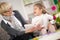 Girl with grandma reading interested book