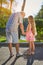 Girl with grandpa outdoors.