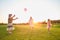 Girl and grandparents playing ball.