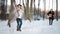 Girl in gray coat on a bridge in winter