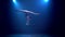 Girl gymnast performs various acrobatics on a table . Smoke blue background. Slow motion