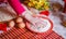 Girl hand in flour cooking biscuits in kitchen