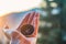 Girl hand holding a compass on the crpathian mountains background