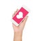 Girl hand holding mobile phone display heart on pink screen