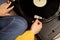 girl hand put tonearm on vinyl record starting turntable Sound meditation