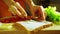 Girl hand spreading soft cheese on a slice of bread