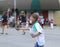 Girl handing out candy in a parade in small town America