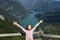 Girl with hands up on a fantastic viewpoint Banjska Stena Tara mountain Serbia