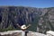 Girl with hands up on the viewpoint Vikos gorge