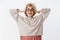 Girl happiest on earth. Charismatic joyful and enthusiastic european blond woman in glasses and warm stylish sweater