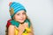 Girl happy face white background. Hat and scarf keep warm. Kid wear warm knitted hat and long scarf. Fall fashion