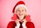 Girl happy wear santa costume celebrate christmas pink background. Merry christmas and happy new year. Woman hold heart