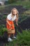 The girl is harvesting vegetables.A girl examines a broken carrot