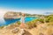 Girl in a hat takes a selfie on the background of stunning views of the azure Bay in the Mediterranean sea. Travel, vacation