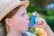 Girl having asthma using asthma inhaler for being healthy