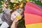 Girl having fun with autumnal leaf and colorful umbrella