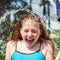 Girl having fun outdoor with water