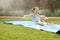 Girl Having Fun On Water Slide In Garden