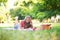 Girl having a picnic and writing in her diary