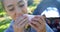 Girl having sandwich in picnic at park