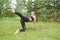 Girl having yoga practicing outdoors,