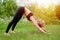 Girl having yoga practicing outdoors.