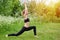 Girl having yoga practicing outdoors.