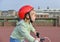 Girl in helmet learns riding bicycle