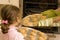 Girl helping mum bake cookies in oven