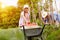 Girl helping in picking tomatoes