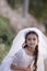 Girl in her First Communion Dress and veil