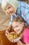 Girl and her grandparent holding a plate with cookies