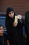 Girl in Hezbollah Participate Funeral Event Wearing traditional black Islamic clothing