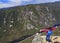 Girl hiker admiring the landscape from Acropoles des Draveures