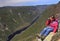 Girl hiker admiring the landscape from Acropoles des Draveures, Quebec, Canada