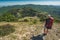 Girl hiker with backpack in a mountains