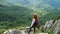 Girl hiker looking a the mountains panorama