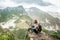 Girl-hiker looking on top of Huayna Picchu, looking on Machu Picchu