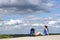 Girl hiker sitting on the sand