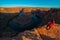 Girl Hiker Standing at the edge of Horseshoe Bend Page Arizona