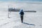 Girl hiking in Giant mountains towards Lucni bouda on a sunny winter day with string freezing wind, Krkonose, Czech republic