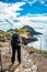 Girl hiking rocky cliffs clear near water of Atlantic Ocean bay Ponta de Sao Lourenco, the island of Madeira, Portugal